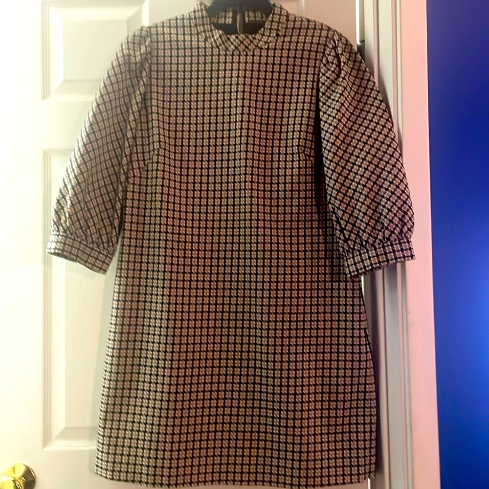 High neck Mini dress with puff sleeves.